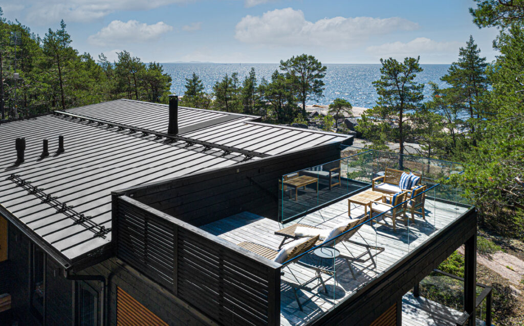 Modern wood house with roof deck in archipelago